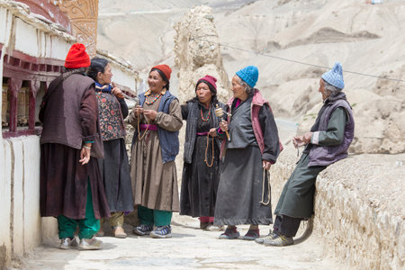 LAMAYURU, INDIA - JUNE 15, 2015: Unidentified buddhist old women during mystical mask dancing Tsam mystery dance in time of Yuru Kabgyat Buddhist festival at Lamayuru Gompa, Ladakh, North Indiaのeditorial素材