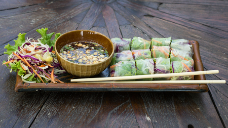 Fresh vietnamese spring rolls on a plate with saladの写真素材