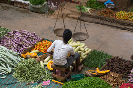 MATARA, SRI LANKA - NOVEMBER 5, 2014: Unidentified sellers in street market sell fresh fruits and...