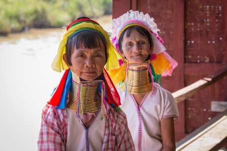 INLE LAKE, MYANMAR - JANUARY 14, 2016: Padaung Tribal women poses for a photo in Inle lake, Myanmar, Burma The Padaung-Karen long-necked tribe women are minority of Myanmar.のeditorial素材