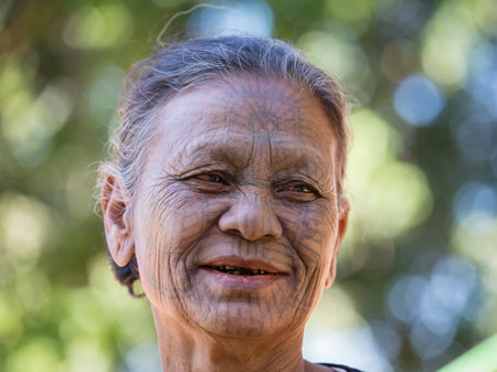 MRAUK-U, MYANMAR - JANUARY 27, 2016: The portrait of Chin woman with spider tattoo. Chin people, also known as the Kukis are a number of Tibeto Burman tribal people.のeditorial素材