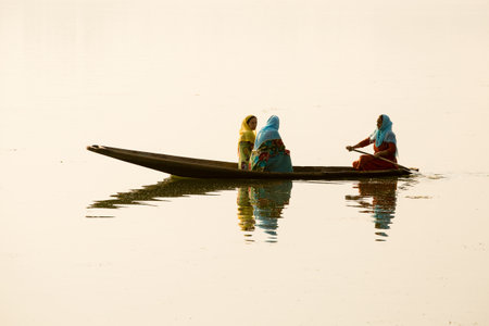 SRINAGAR, INDIA - JULY 07, 2015 : Lifestyle in Dal lake, local people use Shikara, a small boat for transportation in the lake of Srinagar, Jammu and Kashmir state, Indiaのeditorial素材