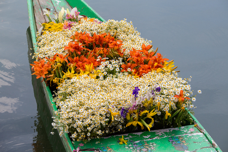 Boat with flowers on Dal Lake in Srinagar. India. Close upの写真素材