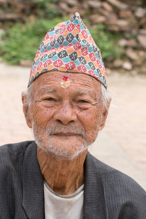 KATHMANDU, NEPAL - SEPTEMBER 29, 2016 : Portrait old men in traditional dress in street Kathmandu, Nepalのeditorial素材
