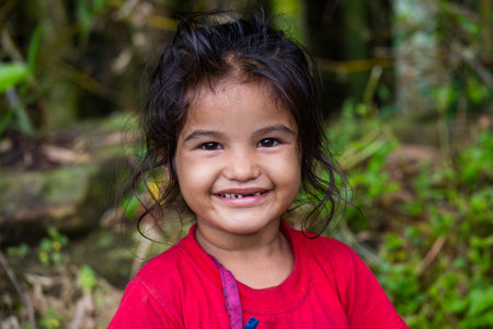 HIMALAYAS, ANNAPURNA REGION, NEPAL - OCTOBER 05, 2016 : Portrait nepalese child on the street in Himalayan village, Nepalのeditorial素材