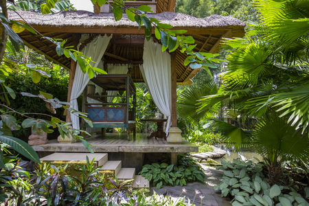 Wooden arbor for relaxing in the tropical garden. Island Bali, Ubud, Indonesiaの写真素材