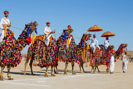 JAISALMER, INDIA - FEBRUARY 09, 2017 : Camel and indian men wearing traditional Rajasthani dress participate in Mr. Desert contest as part of Desert Festival in Jaisalmer, Rajasthan, Indiaのeditorial素材