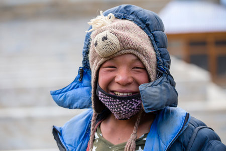HIMALAYAS, ANNAPURNA REGION, NEPAL - OCTOBER 15, 2016 : Portrait man in traditional dress in Himalayan village, Nepalのeditorial素材