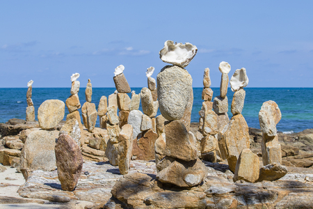 Beautiful pyramids of stone and shells at the beach on the island of Koh Samet, Thailandの写真素材
