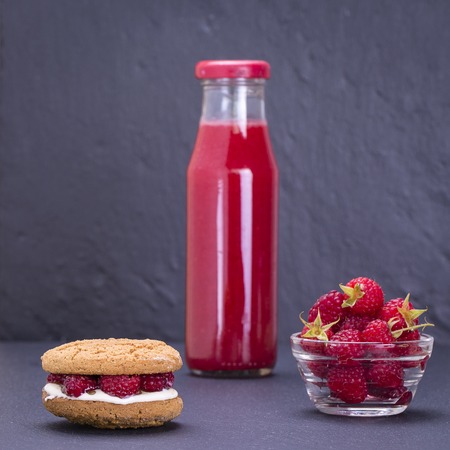 Healthy eating, food, dieting - oat cookies with raspberry, soft cheese, honey and raw raspberry and...