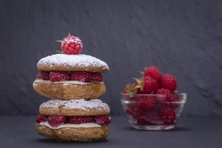 Healthy eating, food, dieting - oat cookies with raw raspberry, honey and soft cheese on the...