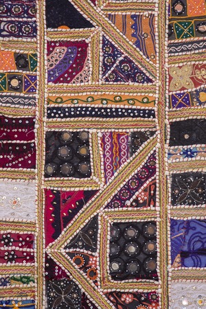 Detail of a colorful patchwork carpet . Close up