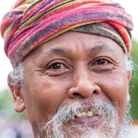 GIANYAR, BALI, INDONESIA - JANUARY 08, 2018 :Unknown Balinese old man participates in street ceremony, during a pre-election rally the Indonesian Democratic Party of Struggle in island Bali, Indonesiaのeditorial素材