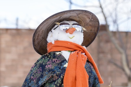 Snowman in Asian clothes in the yard. Close upの写真素材