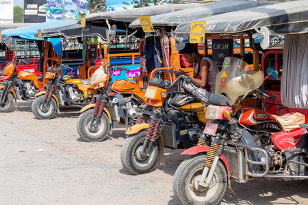 INLE LAKE, MYANMAR - JANUARY 11, 2016: Auto rickshaw, three wheels motorcycle taxi on the street. This transport is cheap and popular in Burma.のeditorial素材