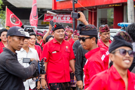 GIANYAR, BALI, INDONESIA - JANUARY 08, 2018 : Agus Mahayastra leads a Indonesian Democratic Party of Struggle, PDI-P, at the pre-election meeting in Gianyar, island Bali, Indonesiaのeditorial素材