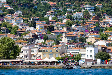 PRINCES ISLANDS, TURKEY - JULY 18, 2015 : View from the ferry, which runs along the route Istanbul - Buyukada. Architecture and tourists on the island Kinaliadaのeditorial素材