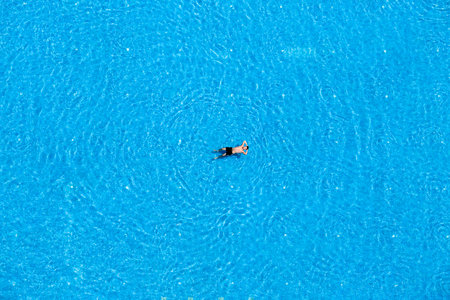 ISTANBUL, TURKEY - JULY 17, 2014 : Unidentified man swim in the swimming pool at the hotel. Top view. Turkey is one of the most attractive destinations for touristsのeditorial素材