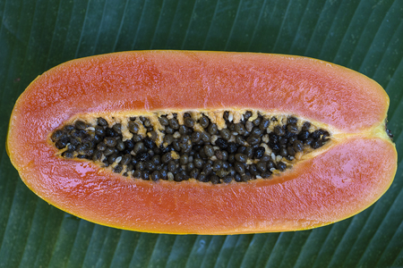 Fresh tropical fruit , sliced of sweet papaya . Thailand, close upの写真素材