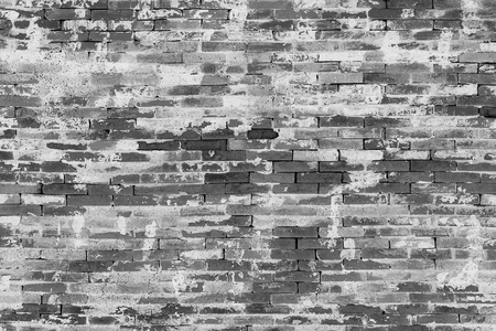 Gray old vintage brick wall, background, texture, black and whiteの写真素材