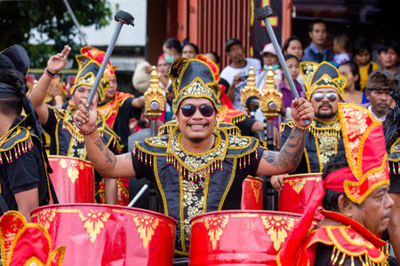 GIANYAR, INDONESIA - JANUARY 08, 2018: Balinese guys play on national musical instruments at street ceremony in pre-election rally the Indonesian Democratic Party of Struggle in island Bali, Indonesiaのeditorial素材