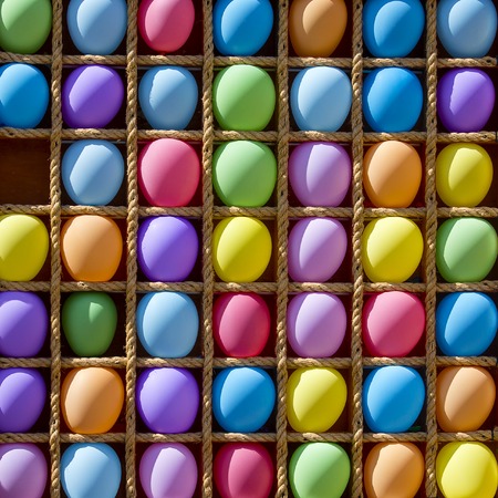 Inflatable multi-colored balls in the cells for playing darts, close upの写真素材