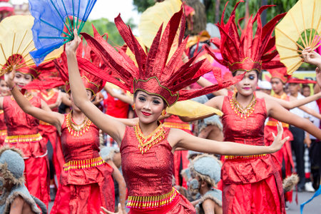 GIANYAR, BALI, INDONESIA - JANUARY 08, 2018 :Unknown Balinese girls dressed in national costume, participates in street ceremony during a pre-election rally the Indonesian Democratic Party of Struggleのeditorial素材