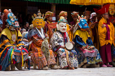 LADAKH, INDIA - JUNE 26, 2015 : Tibetan lamas, dressed in a mystical mask, perform a dance during the Buddhist festival in Hemis Gompa, Ladakh, Northern Indiaのeditorial素材