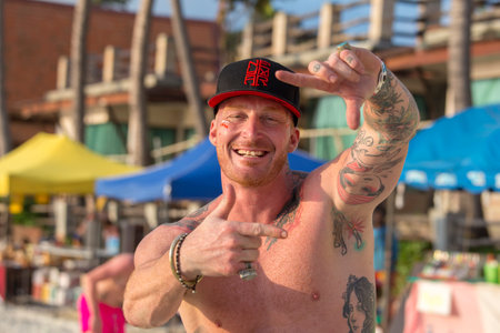 KOH PHANGAN, THAILAND - FEB 01, 2018 : Guys participate in Full Moon party in island Koh Phangan, Thailand. All-night beach party on the night of before or after every full moon for touristsのeditorial素材