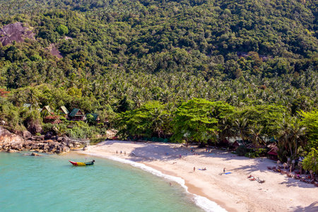 KOH PHANGAN, THAILAND - MARCH 15, 2018 : Than Sadet beach and sea water waves. Koh Phangan Island is one of the most popular destinations for touristsのeditorial素材
