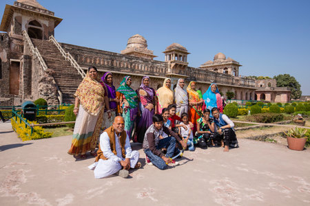 MANDU, INDIA - FEBRUARY 03, 2017 : Unidentified Indian tourists are photographed in the background of the Jahaz Mahal, Ship Palace in Mandu, Madhya Pradesh, Indiaのeditorial素材