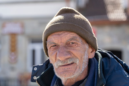MTSKHETA, GEORGIA - OCTOBER 27, 2018 : Portrait of old man with a gray beard near old orthodox cathedral in historical town Mtskheta near Tbilisi, Georgiaのeditorial素材