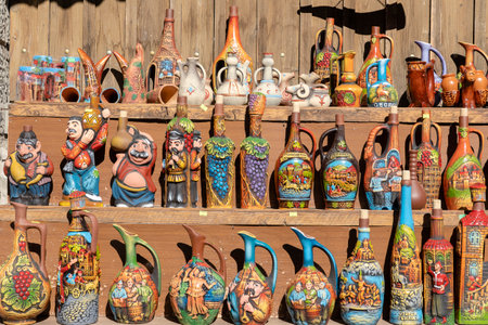 MTSKHETA, GEORGIA - OCTOBER 27, 2018 : Decorative earthenware wine jugs are sold in the tourist market in historical town Mtskheta near Tbilisi, Georgiaのeditorial素材