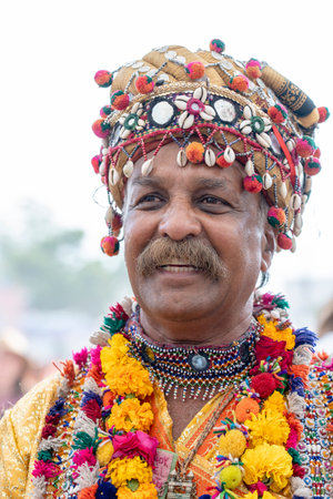 PUSHKAR, INDIA - NOVEMBER 16, 2018 : Indian man dressed in national clothes during Pushkar Camel Mela, Rajasthan, India, close up portraitのeditorial素材