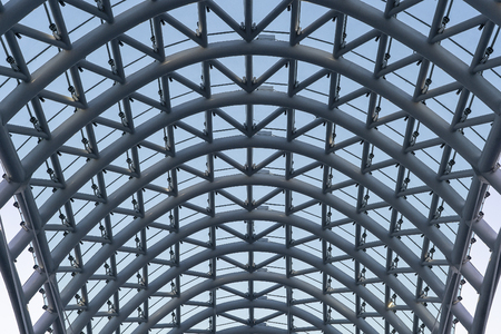 The Bridge of Peace is a bow-shaped pedestrian bridge, a steel and glass construction illuminated with numerous LEDs, over the river in downtown Tbilisi, capital of Georgia.の写真素材