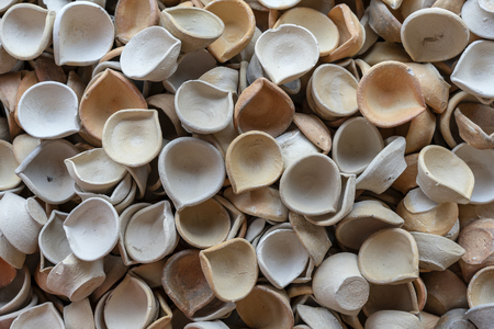 Natural clay tea cups for Indian chai tea for sell at street market, close up, clay tea cup backgroundの写真素材