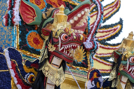 Detail Bade cremation tower with traditional balinese sculptures of demons and flowers on central street in Ubud, Island Bali, Indonesia . Prepared for an upcoming cremation ceremony. Close upの写真素材