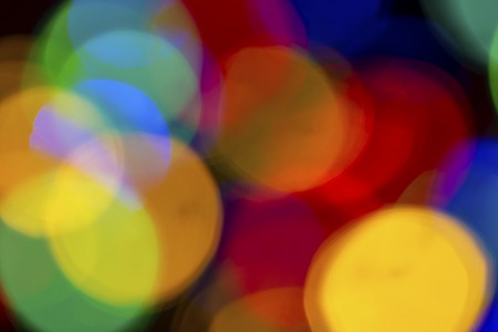 Blurry multicolored garland with glowing lights. Christmas, new year, birthday and wedding concept ....