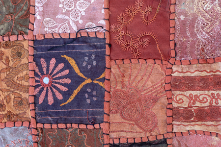Detail old colorful patchwork carpet. Close up