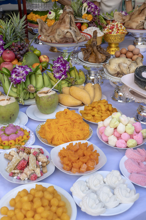Sacrificial offering food for pray to god and memorial to ancestor, Bangkok, Thailand. Close up. Traditional offerings to gods with food, vegetable and fruit for the gods of Thai cultureの写真素材