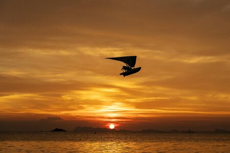 Beautiful sunset over calm sea water. Summer vacation concept. Island Koh Phangan, Thailandの写真素材