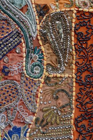 Detail old colorful patchwork carpet, India. Close up