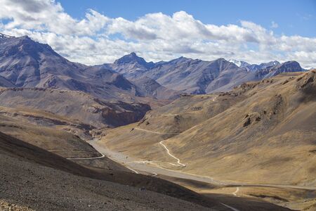 Himalayan mountain landscape along Leh to Manali highway in India. Winding road and majestic rocky mountains in Indian Himalayas, Ladakh, Jammu and Kashmir region, India. Nature and travel conceptの写真素材