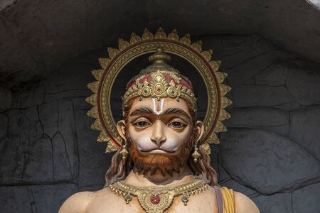 Hanuman statue, Hindu idol near Ganges River, Rishikesh, India. Sacred places for pilgrims in...