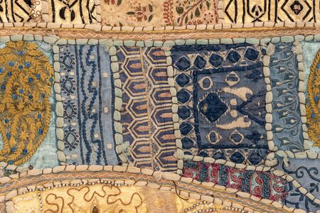 Detail old colorful patchwork carpet, India. Close up