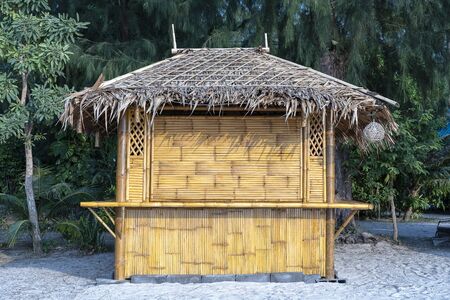 Bamboo hut on the tropical sand beach in island Koh Phangan, Thailand, close upの写真素材