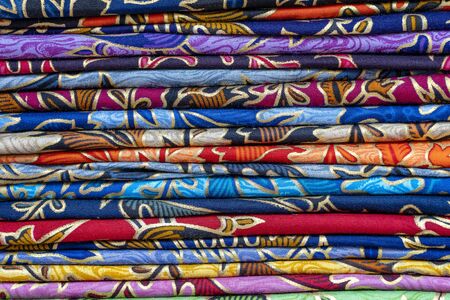 Assortment of colorful sarongs for sale in local market, Island Bali, Ubud, Indonesia. Close upの写真素材