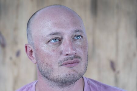 Closeup shoot of middle-aged caucasian bald man. People and lifestyle concept. Portrait of middle...
