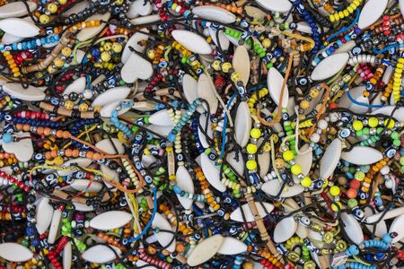 Traditional wristband for sale at a street market stall in Bodrum, Turkey. Close up. Bracelets at...