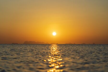 Beautiful sunset over the sea water on the island of Koh Phangan, Thailand. Travel and nature...